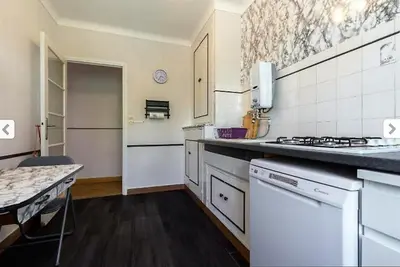 a kitchen with a stove and a counter top at Villa Lerina in Cannes