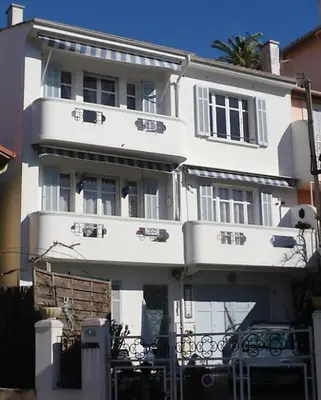 a large white building with a lot of windows at Villa Lerina in Cannes