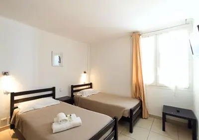 a hotel room with two beds and a window at Viva Riviera 2 Bedrooms 2 Bathrooms Rue Florian in Cannes