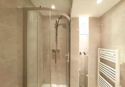 a shower with a glass door in a bathroom at Viva Riviera 2 Bedrooms 2 Bathrooms Rue Florian in Cannes