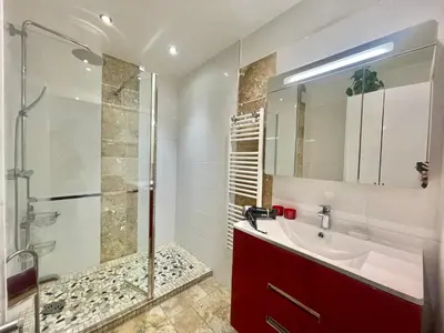 a bathroom with a red sink and a shower at Studio Grand hôtel Croisette, by Welcome to Cannes in Cannes