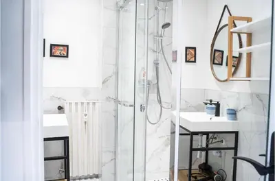a bathroom with a shower and a sink at Majestic Apartment in Cannes