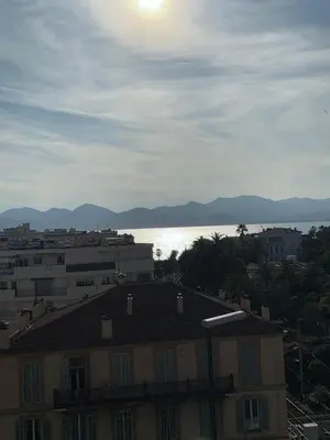 a view of a building and a body of water at Villa Rimbaud in Cannes