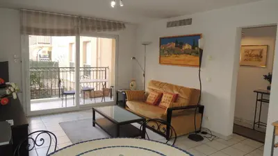 a living room with a couch and a table at CANNES Palazzio in Cannes