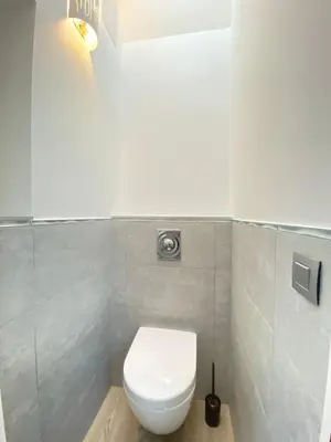 a bathroom with a white toilet in a room at Modern & bright 4-room apartment in Cannes Banane in Cannes