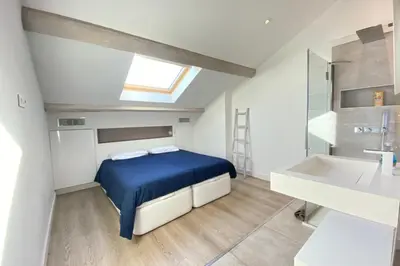 a bedroom with a bed and a sink at Modern & bright 4-room apartment in Cannes Banane in Cannes