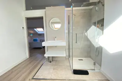 a bathroom with a white sink and a shower at Modern & bright 4-room apartment in Cannes Banane in Cannes