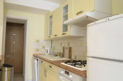 a kitchen with a sink and a stove top oven at Viva Riviera - 5 Rue Commandant André in Cannes