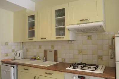 a kitchen with a sink and a stove top oven at Viva Riviera - 5 Rue Commandant André in Cannes