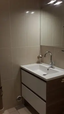 a bathroom with a sink and a mirror at Elegant Apart in City Centre of Cannes in Cannes