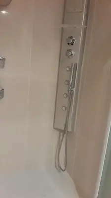 a white bathroom with a shower with a shower at Elegant Apart in City Centre of Cannes in Cannes