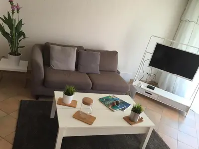 a living room with a couch and a table at Immeuble le St Honorat in Cannes