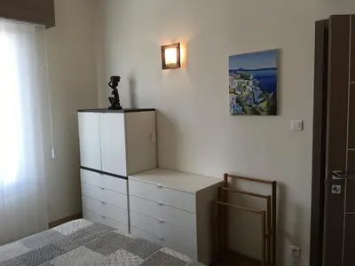 a room with a dresser and a picture on the wall at Appartement Cannes sur Croisette in Cannes
