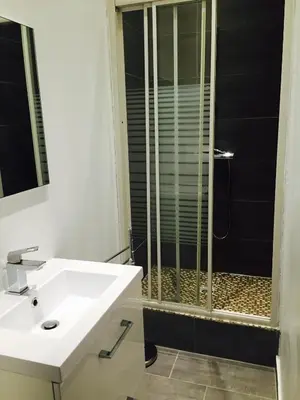 a bathroom with a sink and a shower at CANNES CROISETTE b in Cannes