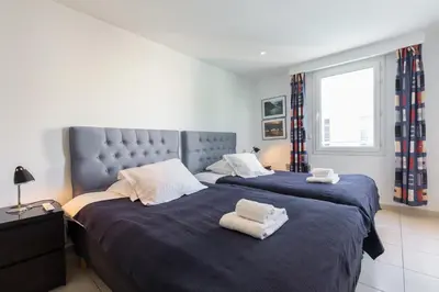 a bedroom with two beds with towels on them at Superb penthouse in centre of Cannes Stunning views air-conditioning internet Near the Palais 532 in Cannes