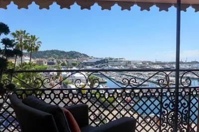 a balcony with a view of a harbor at Résidences Cresci in Cannes