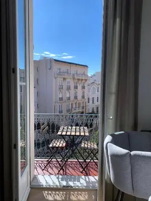 a bathroom with a sink and a toilet and a mirror at A 2 pas de la croisette in Cannes