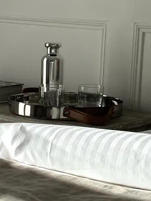 a kitchen and living room with a counter and stools at A 2 pas de la croisette in Cannes