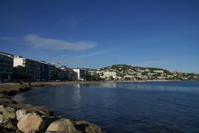 a large body of water with buildings and buildings at Palais Rouaze in Cannes