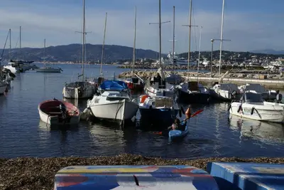 a bunch of boats docked in a harbor at Palais Rouaze in Cannes