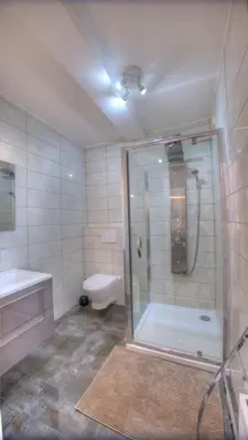 a bathroom with a shower and a sink and a toilet at Studio Vieux Port 3 étoiles in Cannes