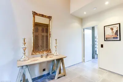 a mirror on a table in a room at Florella Félix Faure in Cannes