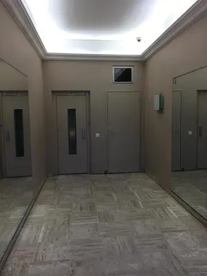 a row of doors in a room with mirrors at Studio Croisette Cannes in Cannes