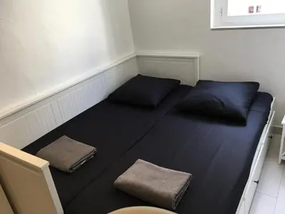a room with two pillows sitting on the floor at Studio Croisette Cannes in Cannes