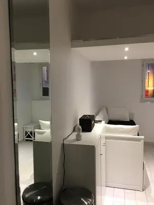 a bathroom with two stools and two toilets in a room at Studio Croisette Cannes in Cannes