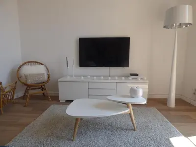 a living room with a tv on a white cabinet at Happy days, by Welcome to Cannes in Cannes