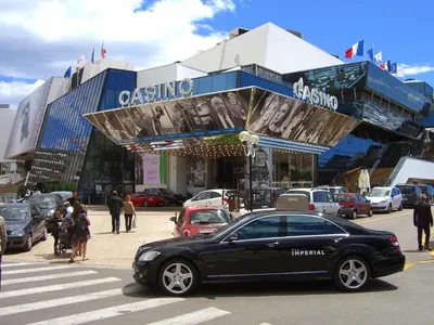 a black car parked in front of a building at Sea Side apartment in Cannes