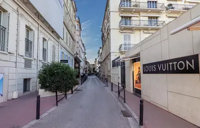 an empty street in a city with buildings at Studio Carré d'or Cannes in Cannes