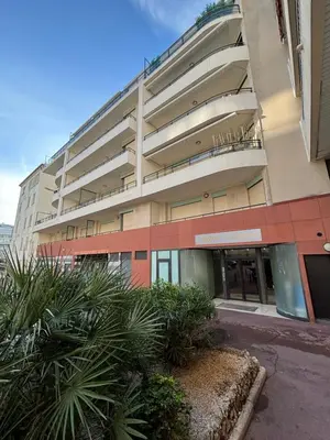 an apartment building with plants in front of it at Viva Riviera - Studio Jardin Florian in Cannes