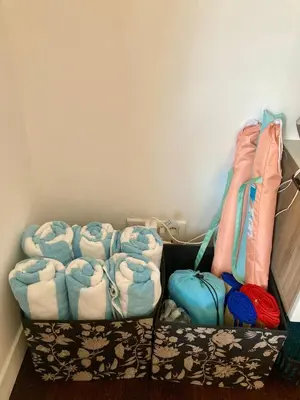 a room with a row of folded towels and bags at Cannes City B&B in Cannes