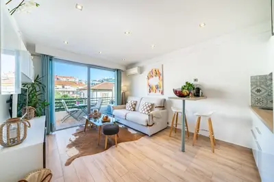a living room with a couch and a table at STUDIO by the croisette in Cannes