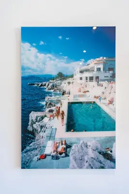 a swimming pool on the side of a cliff next to the ocean at STUDIO by the croisette in Cannes