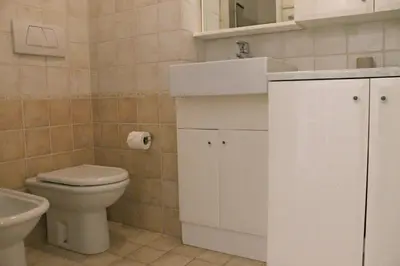 a small bathroom with a toilet and a sink at Viva Riviera Cosy and Large 2 Bedrooms with balcony in Cannes