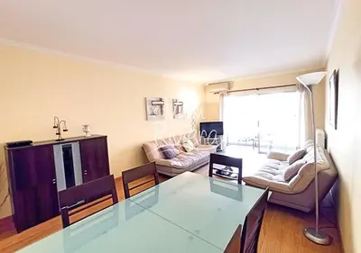 a living room with a glass table and a couch at Viva Riviera Cosy and Large 2 Bedrooms with balcony in Cannes