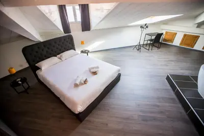 a bedroom with a bed with two stuffed animals on it at Sherlock Loft by Connexion in Cannes