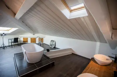 a bathroom with a large tub and two toilets at Sherlock Loft by Connexion in Cannes
