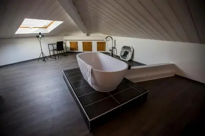 a large bath tub sitting on a table in a room at Sherlock Loft by Connexion in Cannes