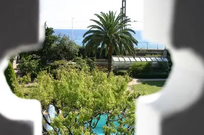 a view of the ocean from a window at Villa Belle Rive in Cannes