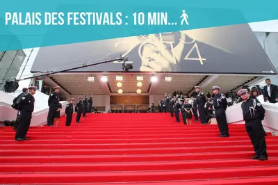 a group of men in suits standing on a red carpet at Close Palais - Calm - Brand New in Cannes