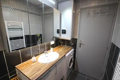 a bathroom with a sink and a mirror at Close Palais - Calm - Brand New in Cannes