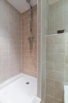 a bathroom with a shower with a tub at Florella Maréchal Joffre in Cannes