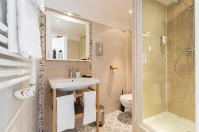 a bathroom with a sink and a toilet and a shower at Florella Maréchal Joffre in Cannes