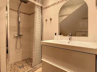 a bathroom with a sink and a shower at 1 bedroom Forville, 4 min Palais,Plages,Croisette in Cannes