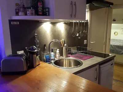 a kitchen with a sink and a counter top at Suquet26 in Cannes
