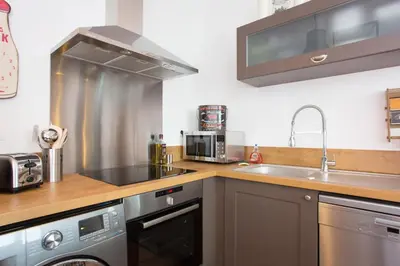 a kitchen with a sink and a stove at Budin Sea Cannes in Cannes
