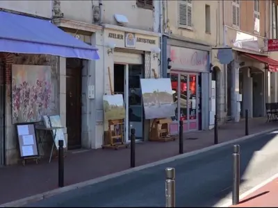 an empty city street with shops on the side of the road at Suquet's Luxury Studio in Cannes